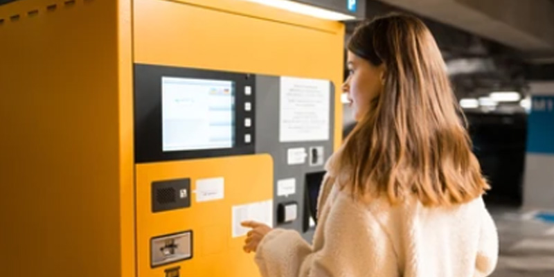 cellulaire et borne de paiement dans un stationnement